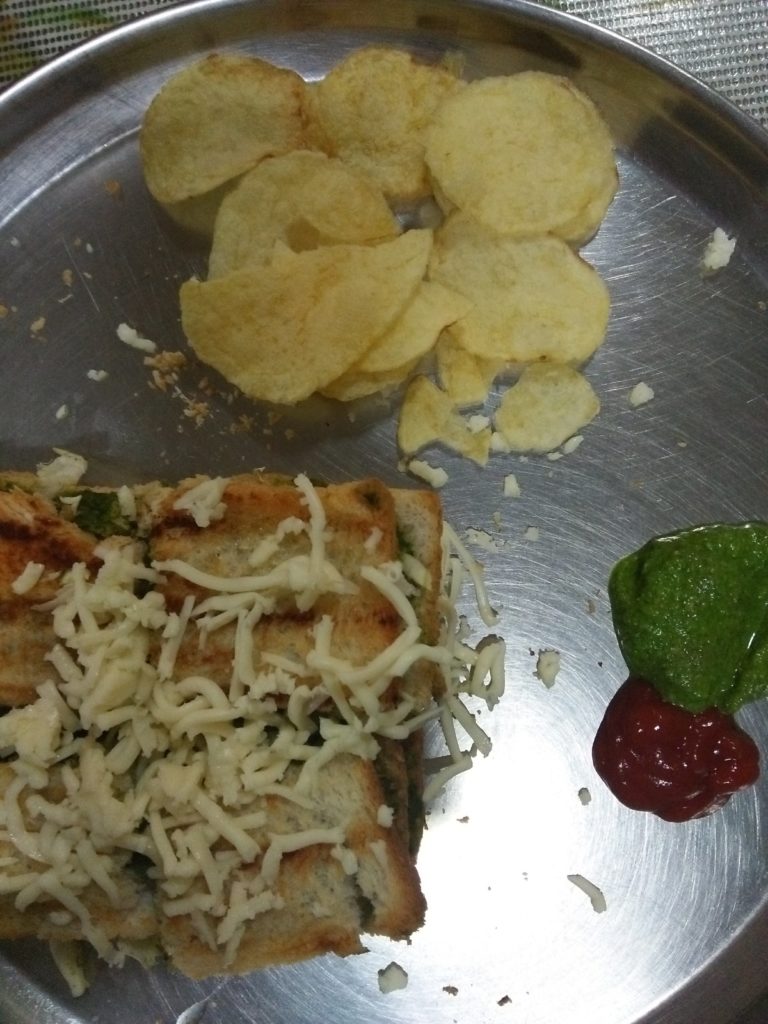 Cheese Grilled Sandwich served with Potato wafers, green chutney and Tomato Ketchup. street food recipe to make in lockdown