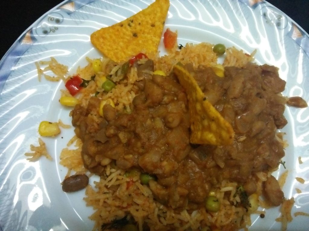 Hot Mexican Rice served with bean sauce and nacho chips