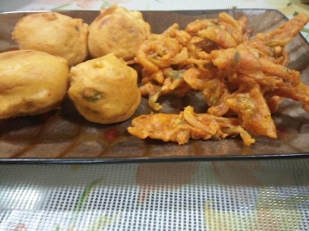 Batata Vada and Onion Pakoras served in a tray
